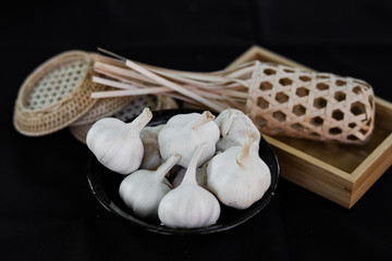 garlic bulbs on vintage wooden background