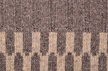 Texture of a piece of brown wool knit fabric