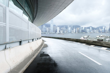 empty road and modern building cloudy skyline