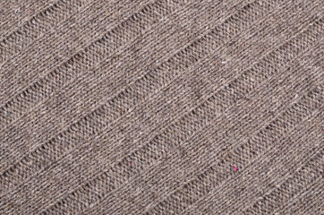 Texture of a piece of brown wool knit fabric