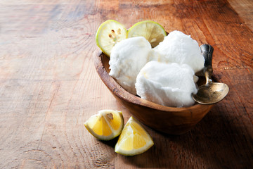 lemon sorbet in a wooden bowl from the olive tree to the table.