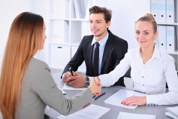 Business people shaking hands, finishing up a meeting