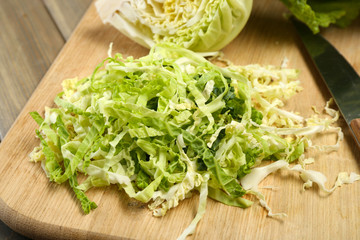 Cut savoy cabbage on wooden cutting board