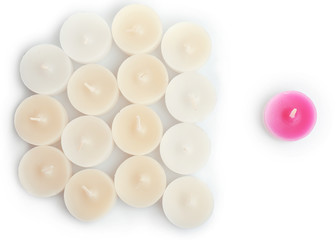 Pink and white small candles, isolated on white