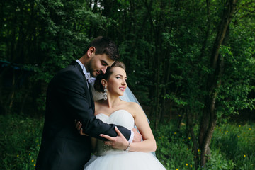 Beautiful wedding couple on nature