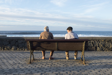old people looking the sea