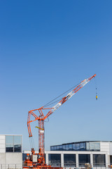 on duty construction crane on top of the building