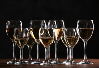 Half full wine glasses on a table