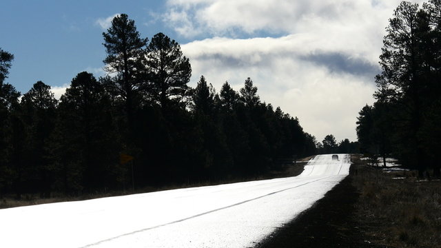 Car Driving Away on Rainy Highway. High Contrast 4K time-lapse footage.