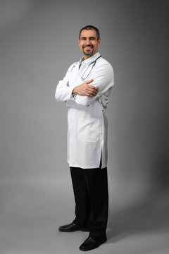 Portrait of a doctor on grey background