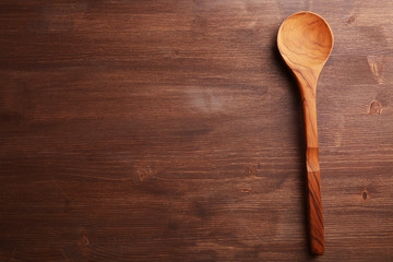 Wooden spoon on the table, close-up