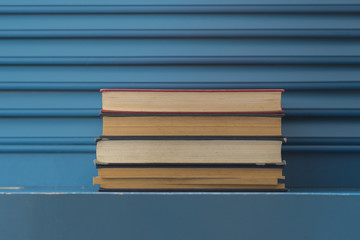 Fototapeta premium vintage books on blue background