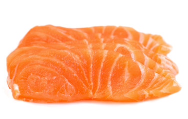 Sliced raw salmon isolated on white background