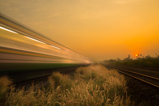 Train Passing by over Rural Railway Bridge in the Morning or at