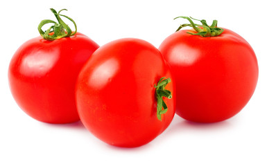 three fresh tomatoes with green leaves isolated on white background