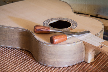 Classical guitar under construction in luthier workshop