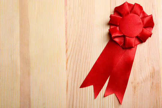 Award ribbon on wooden background