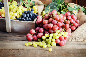 Grape in wooden box on a table