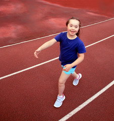 Little girl have fun on the stadium