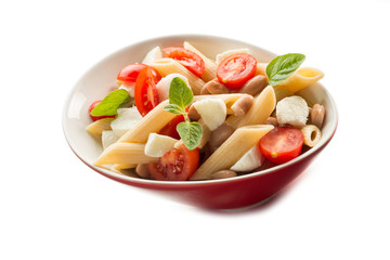 cold pasta salad with slice tomatoes mozzarella and beans