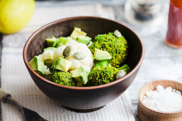 Winter vegetable salad with broccoli, cauliflower, avocados, pum