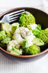 Winter vegetable salad with broccoli, cauliflower, avocados, pum