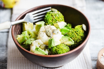 Winter vegetable salad with broccoli, cauliflower, avocados, pum