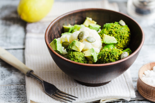 Winter vegetable salad with broccoli, cauliflower, avocados, pum