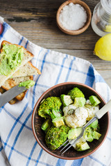 Winter vegetable salad with broccoli and cauliflower, toast with