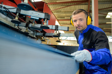 Male operative using machinery