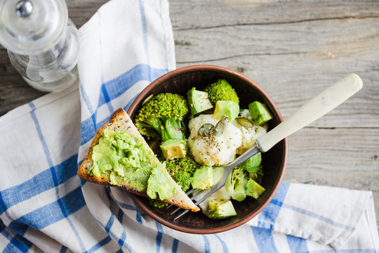 Winter vegetable salad with broccoli and cauliflower, toast with