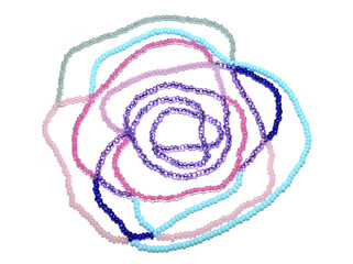 Abstract rose of pink, blue and silver beads on white background