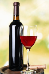 Wine on blurred natural background