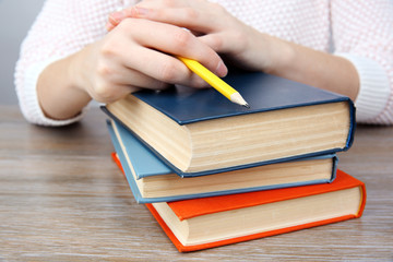 Woman working with books, close up
