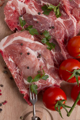 Fresh raw pork chop meat on cutting board