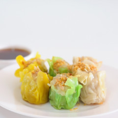 Chinese steamed dumpling, SHUMAI with sour sauce.