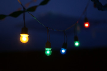 Christmas light bulb on dark background