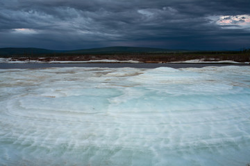 Frazil on the river on a cloudy day. Moma River. Yakutia. Russia.