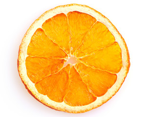 Dried orange slice from above on white background