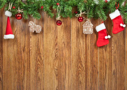 Christmas decoration with gingerbread cookies on wooden background wall