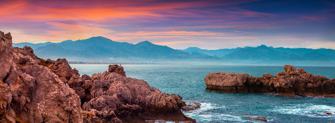Colorful spring panorama of sunrise on the harbor Milazzo