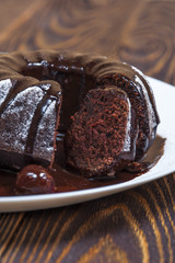 Chocolate cake with glazed cherry 