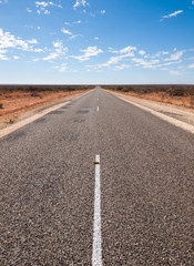 Australia, Outback, 09/10/2015, Long outback australian road with a beautiful blue sky disappearing into the horizon
