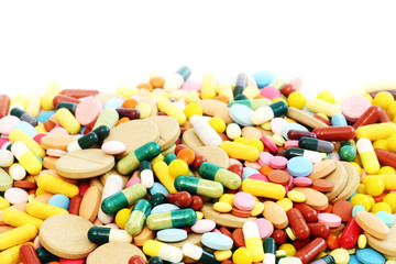 Colored pills on a white background