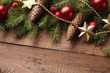 Christmas tree branch, stars, cones, balls on the background of