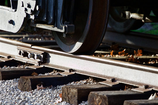 Fototapeta Photo of the train wheels and the road