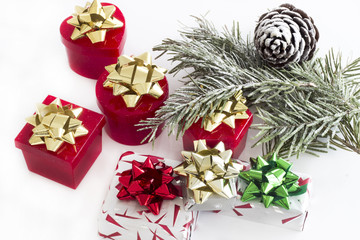 Christmas background with gift boxes and pinecone