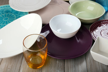 Different tableware on wooden table close up