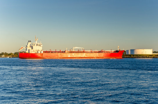 Tanker Ship Moored in Harbour at Sunset. 