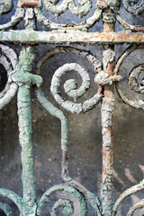 Old rusty forged fence, close up